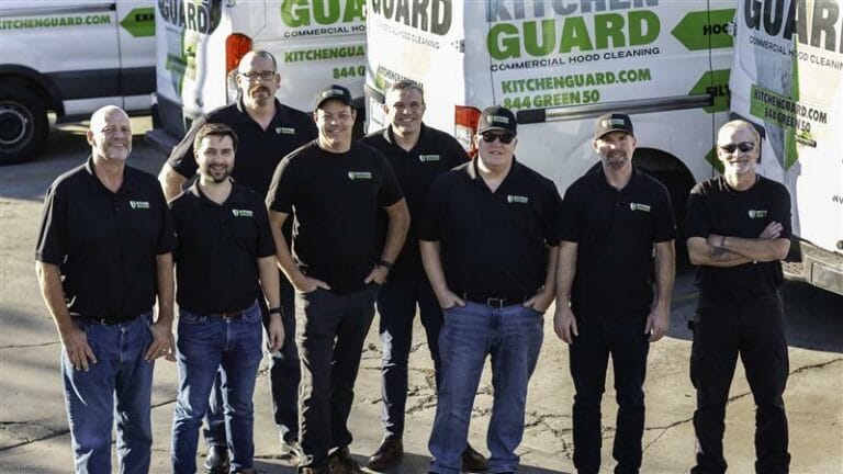 A group of kitchen guards in uniform, focused on providing assistance and answering FAQs related to kitchen safety.